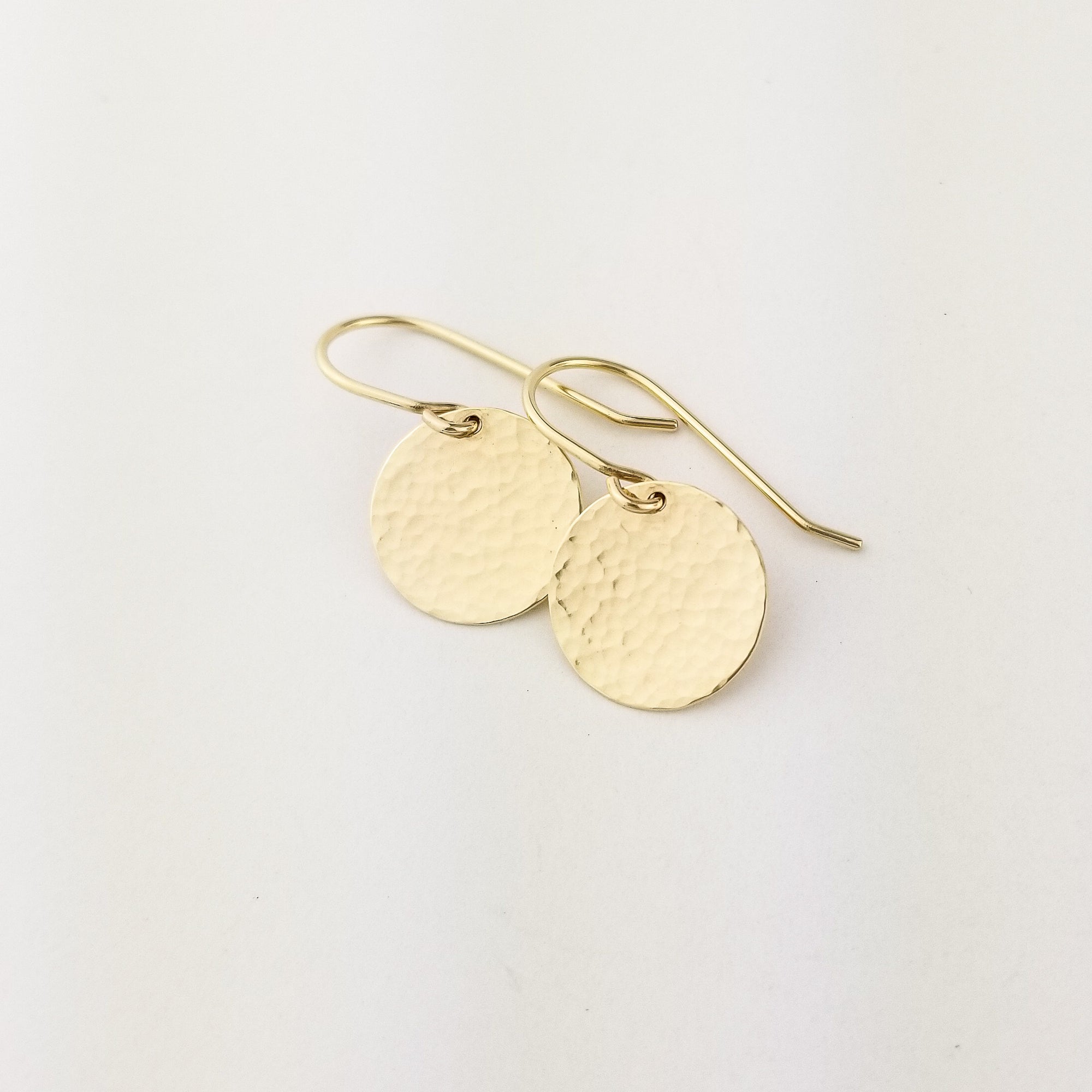 Solid 14 Karat Yellow Gold Hammered Flat Disc Earrings with 14 Karat Ear Wire on White Background
