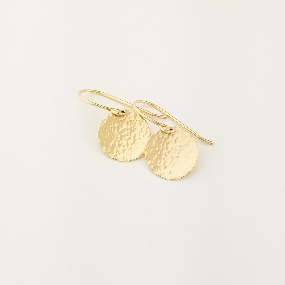 Solid 14 Karat Yellow Gold Hammered Flat Disc Earrings with 14 Karat Ear Wire on White Background