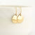 Hammered Domed Disc Earrings Solid 14 Karat Yellow Gold with 14 Karat Ear Wire Held in Hand