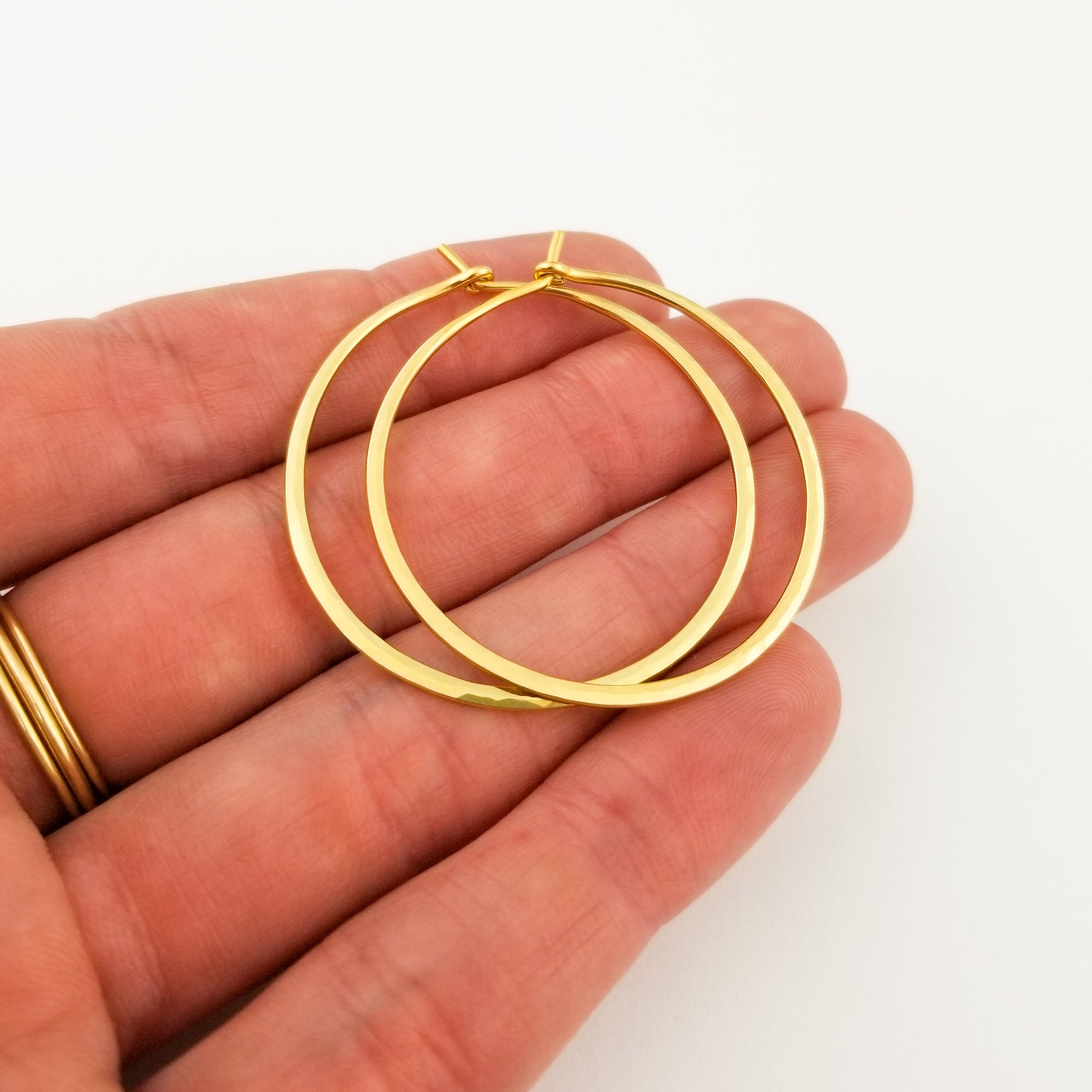 Extra Thick Solid 22 Karat Yellow Gold Hammered Hoop Earrings Held in Hand