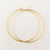 Thin Solid Gold Hoop Earrings Handmade with 14 Karat Yellow Gold Held in Fingers