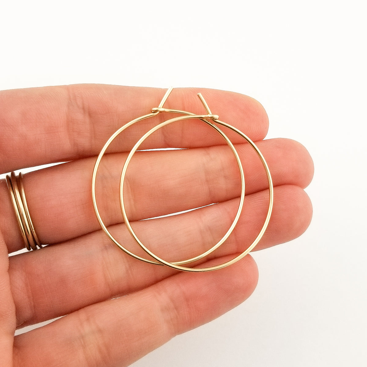 Solid Gold Hoop Earrings in Solid Yellow 14 Karat Gold Thick Classic Style Held in Hand